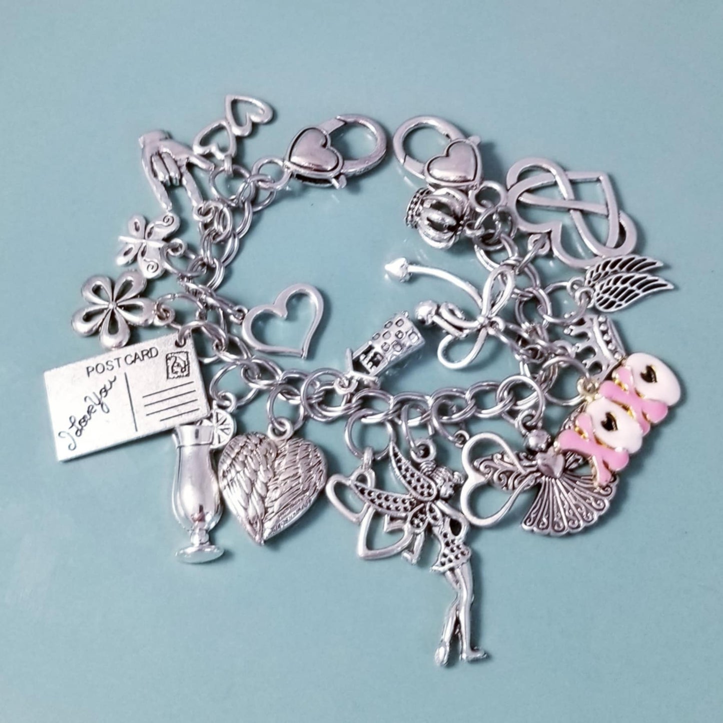 7 1/4-inch Pink XOXO Charm Bracelet with Heart Clasp – Whimsical Loaded Charm Collection