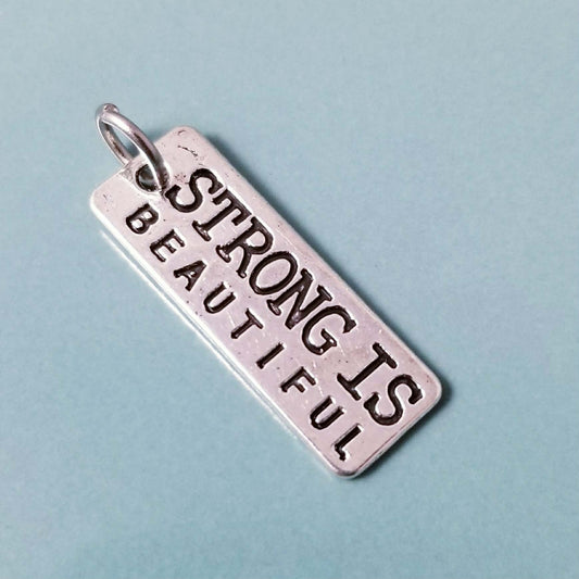 Strong is Beautiful Charm – Silver Empowerment Jewelry