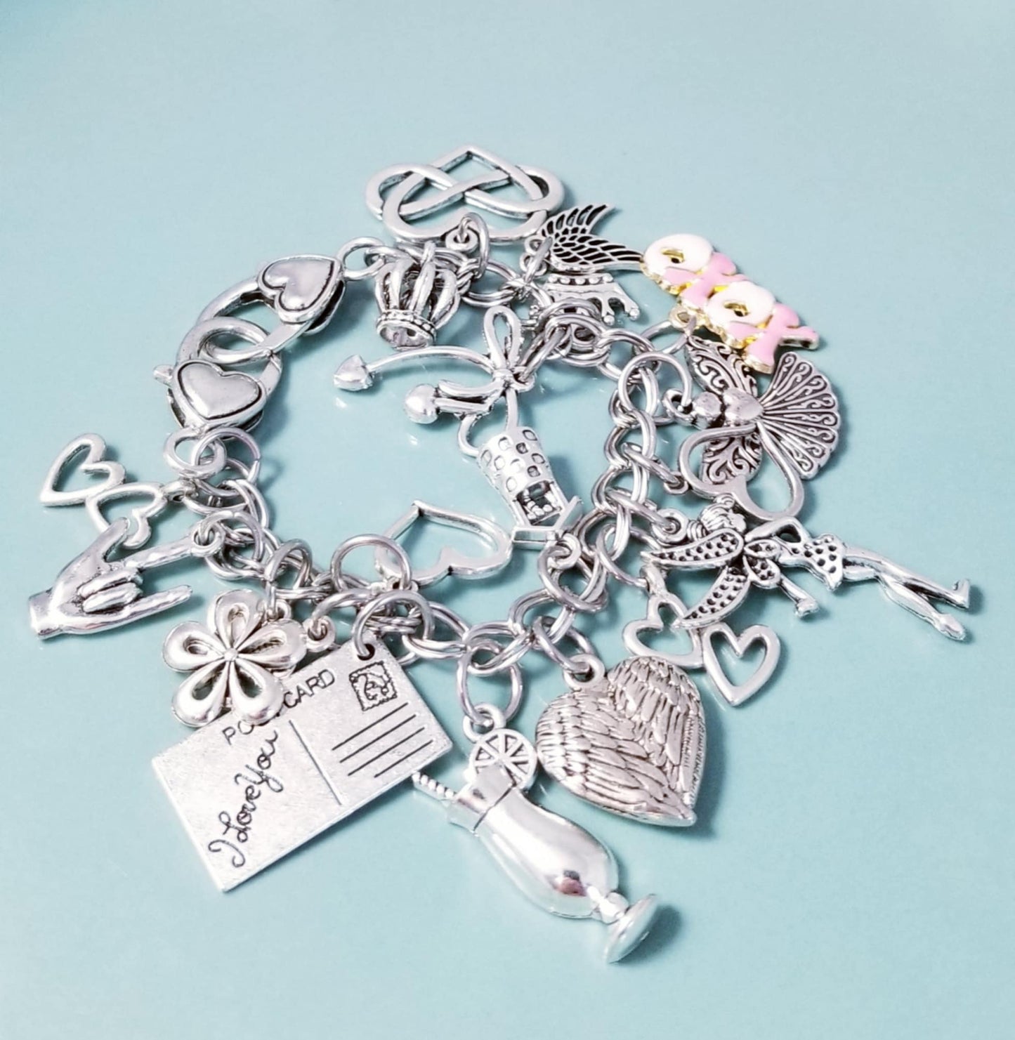 7 1/4-inch Pink XOXO Charm Bracelet with Heart Clasp – Whimsical Loaded Charm Collection